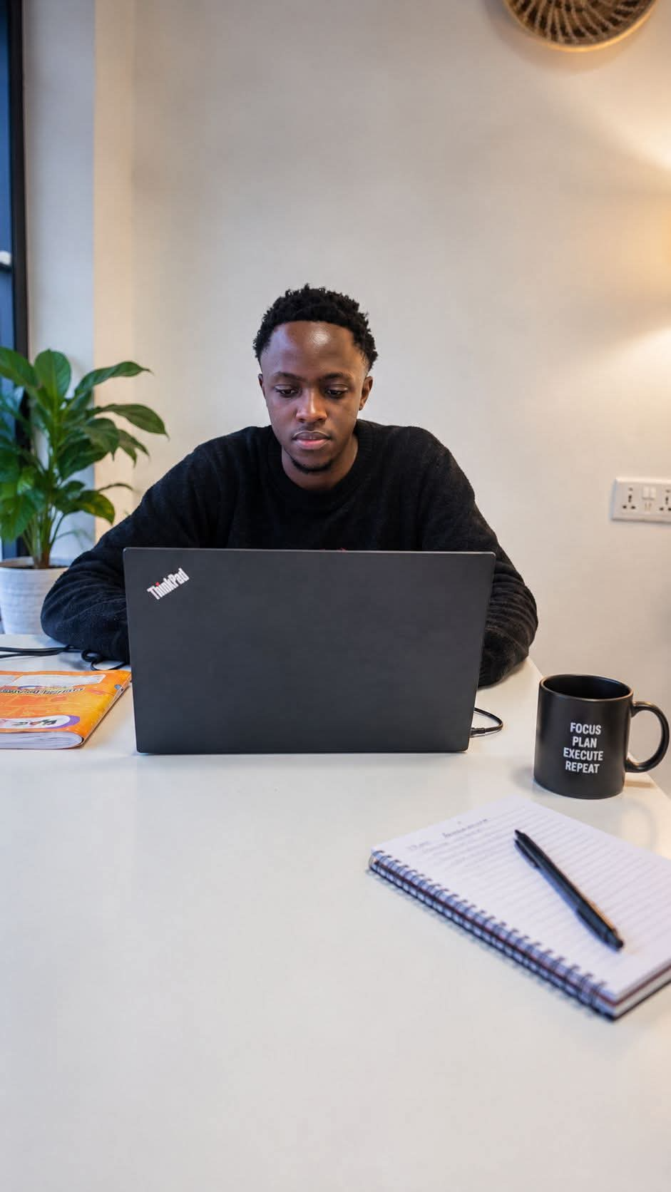 Wambugu John preparing lessons at his desk